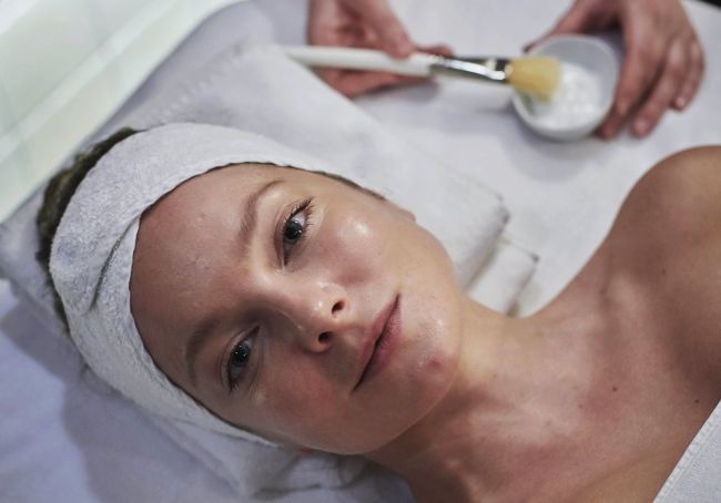 Hungarian top model, Enikő Mihalik getting a facial treatment.